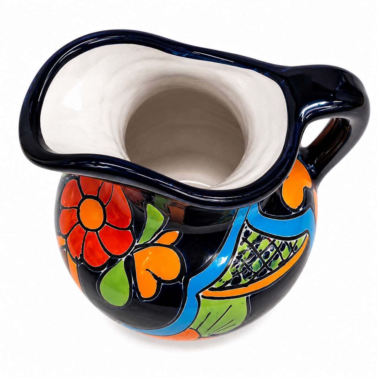 A ceramic pitcher with a glossy black exterior decorated with vibrant hand-painted floral and leaf patterns in red, orange, green, and blue, featuring a contrasting white glazed interior.