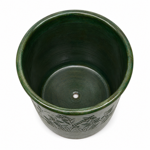 A dark green glazed ceramic planter pot with a hand-painted bamboo design on the exterior, shown from a top-down perspective on a white background.
