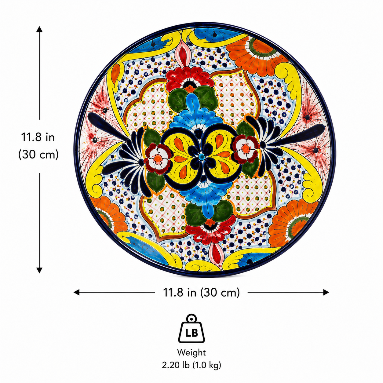 Round hand-painted ceramic plate with a vibrant Mexican Talavera style design, shown with dimension arrows indicating a diameter of 11.8 inches (30 cm) and a weight icon showing 2.